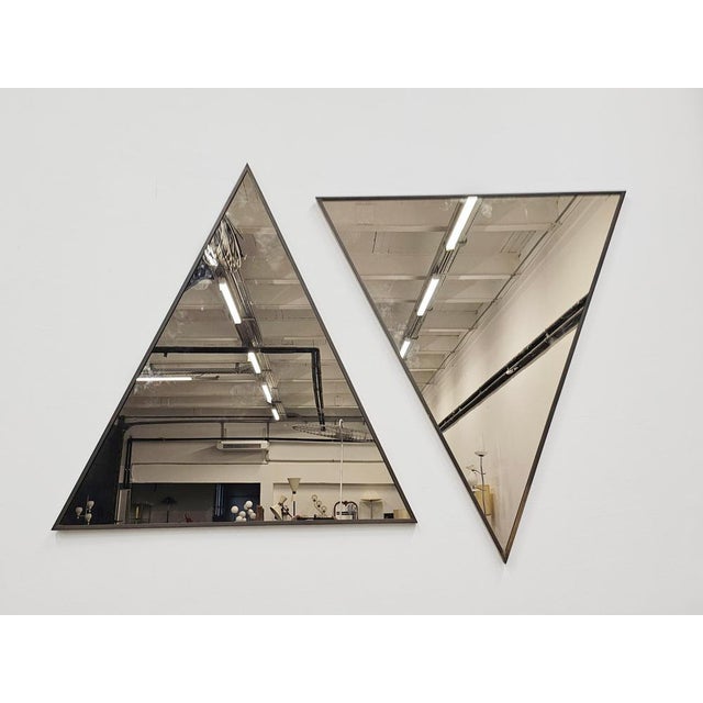In this listing you will find a pair of exceptionally rare Mid Century Modern Triangular Mirrors. The mirror frames are...