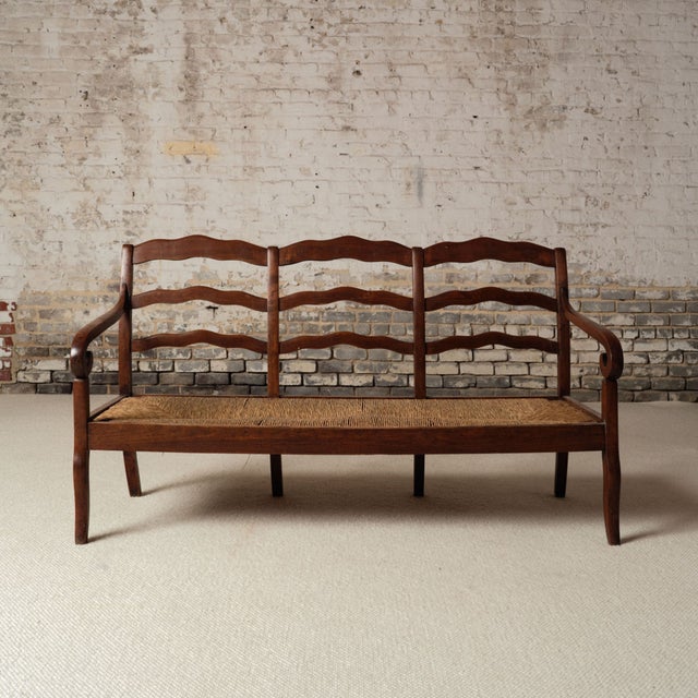 Add timeless French charm to your interior with this 19th century French Provincial oak canapé, a beautifully restored...