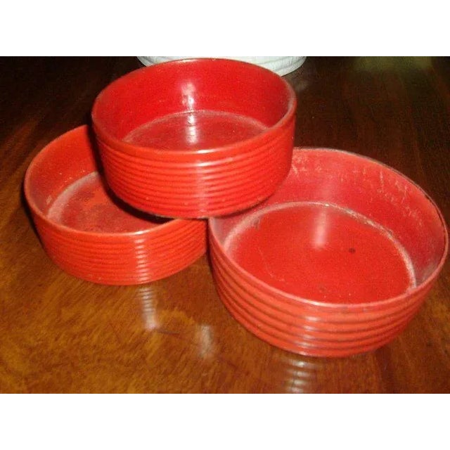 Set of three Regency cinnabar lacquer decanter coasters. The largest measures 5.5" in diameter x 2" deep. the smallest...