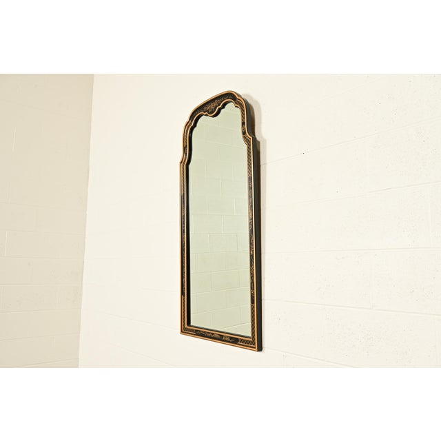 A gorgeous Hollywood Regency Chinoiserie tall wall mirror By Drexel Heritage USA, Circa 1980s Black lacquered mahogany,...
