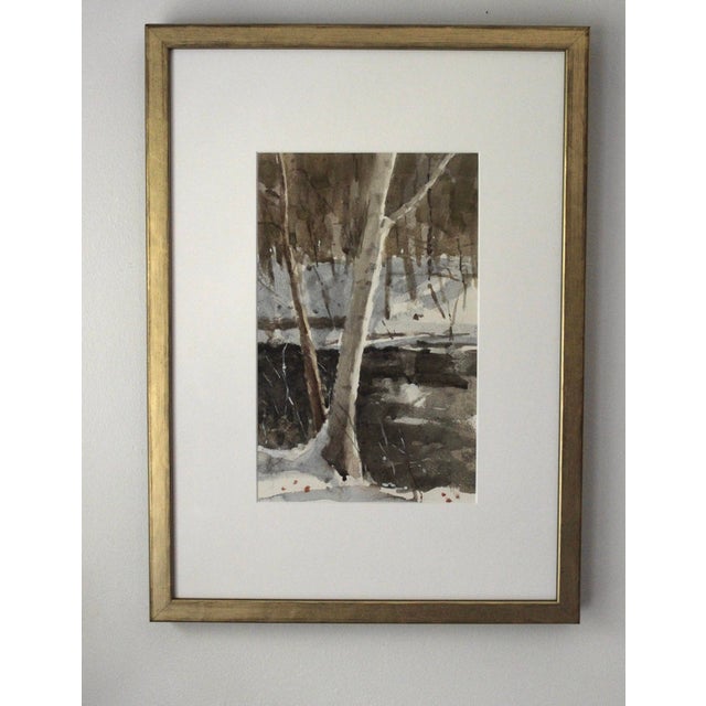 The artwork depicts a serene riverside scene, where the gentle flow of water contrasts with the textured bark of a tree,...