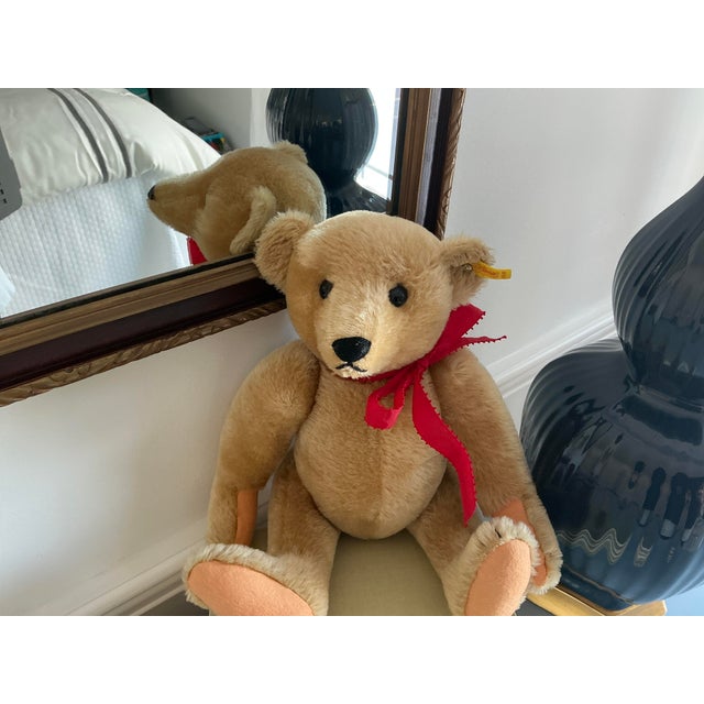 Classic Steiff 50% wool / 50% cotton vintage teddy bear. Original tag. Excellent condition. Head, arms and legs movable.