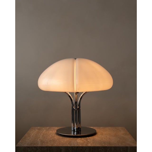 A vintage italian space age table lamp in white moulded acrylic and chrome, designed by ufficio progetti for harvey...