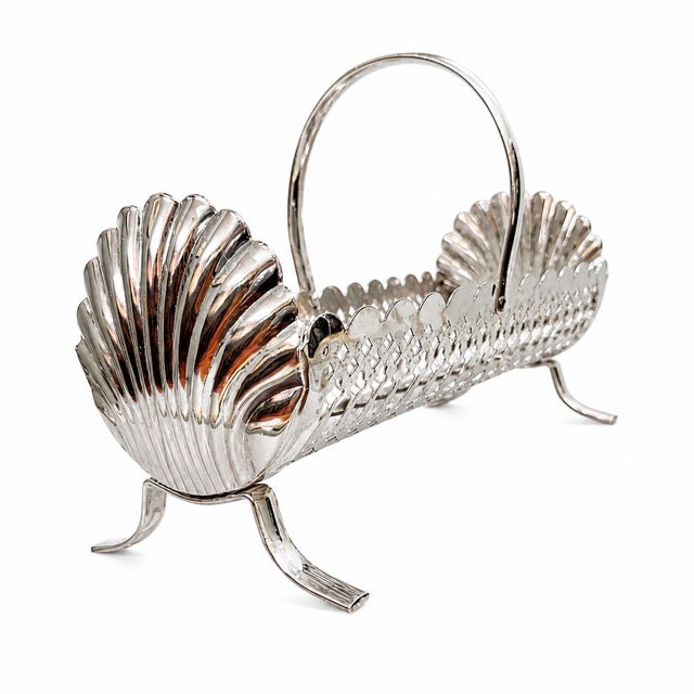 Charming and unique vintage silver-plated biscuit tray featuring an elegant, timeless shell motif design. In excellent...