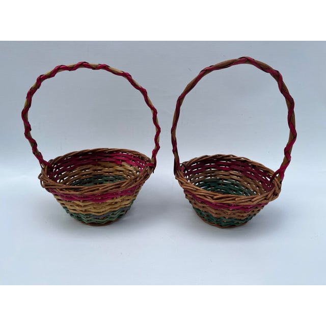 A pair of small wood Easter baskets with yellow pink and green finish and round handles. This pair of small baskets would...