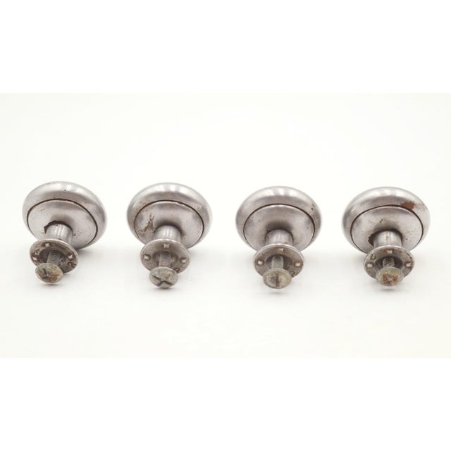 Classic style cabinet or drawer knobs made of brushed steel. Mounting screws are included. Good condition with surface...