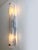Contemporary rectangular wall sconce made in clear graniglia of Murano glass. Made with a traditional Murano glass slab...
