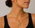Detailed 14k yellow gold pendant in the shape of a textured starfish. 3.43g
