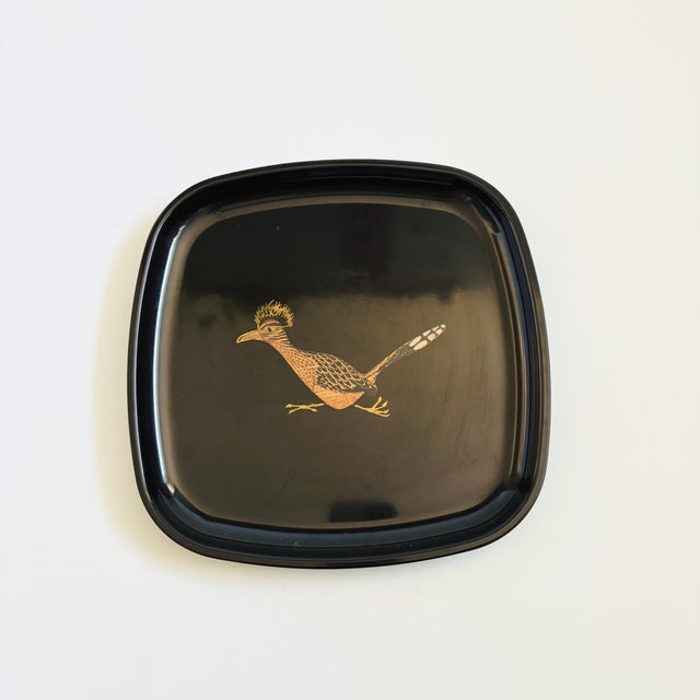 A wonderful vintage rounded square tray. The image of a roadrunner in the center of the dish is formed from small pieces...