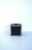 A black tissue box cover with faux-diamond design. Cover is a black powder-coated metal with faux diamond design on two...