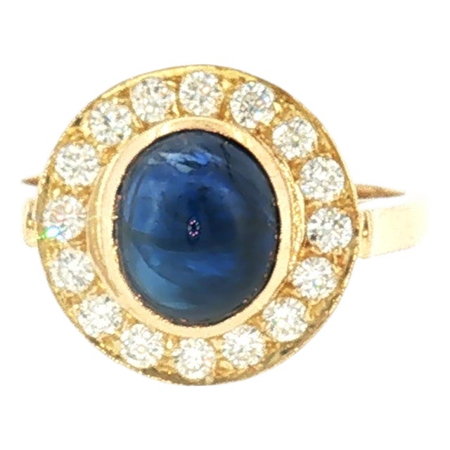 Late 20th-Century 18 Karat Yellow Gold Cabochon Blue Sapphire Halo Ring, Size 6.75 For Sale