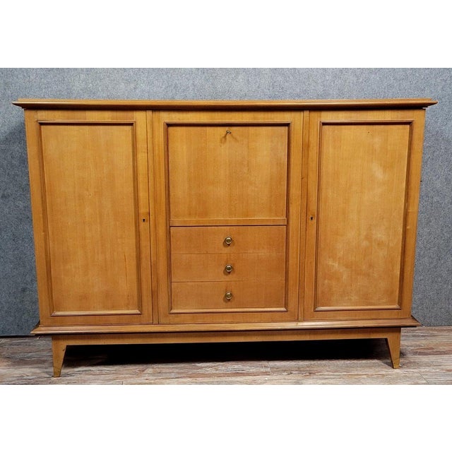 Vintage Scandinavian style teak sideboard, circa 1950 The front opens with three drawers, two doors, and a drop-down door...