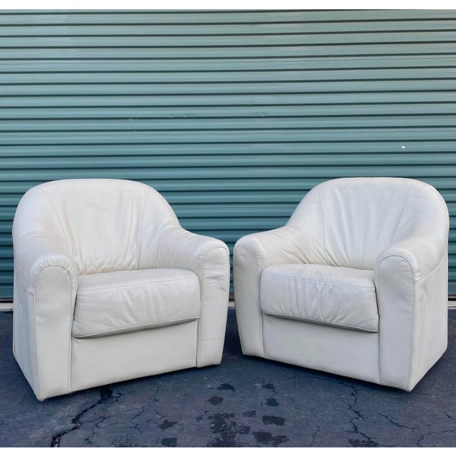 Contemporary Italian Natuzzi Ivory Leather Swivel Chairs, a Pair Chairish