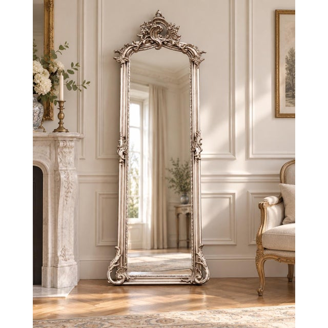 This striking circa 1980 European Baroque Rococo Revival floor mirror combines ornate sculptural detailing with a softly...