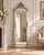 This striking circa 1980 European Baroque Rococo Revival floor mirror combines ornate sculptural detailing with a softly...