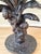 Exceptional vintage tropical table lamp featuring sculptural monkeys climbing a dramatic banana palm tree base with...