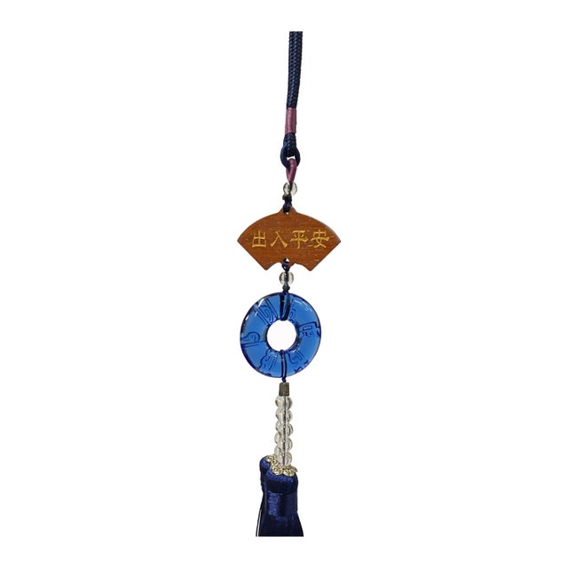 This is a liuli crystal glass art piece in a Chinese Fengshui blue round shape pendant. It is made into a decorative...