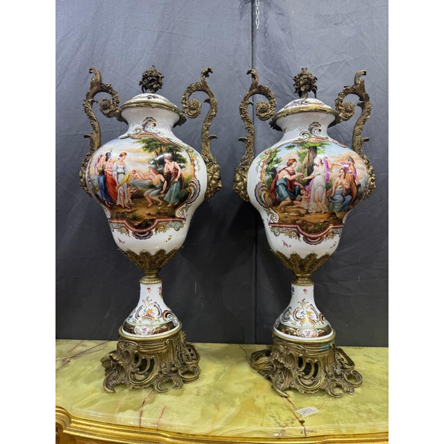 Pair of vases with hand-decorated porcelain lids and bronze handles in the 4 paintings we find floral motifs. This piece...