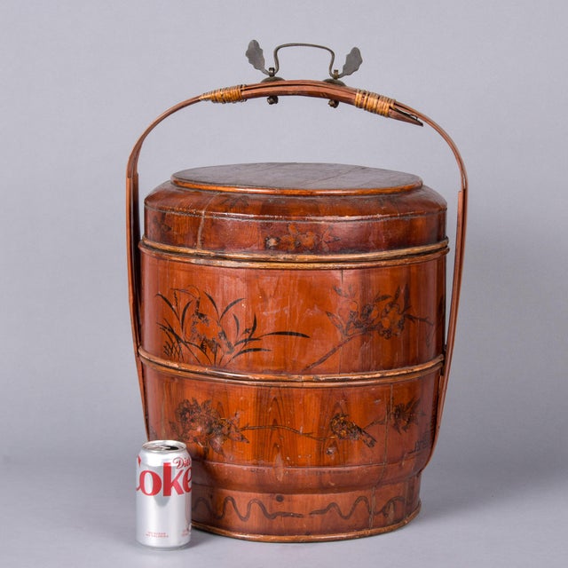 A Chinese three-tier stacking wedding basket (tí lán), circa 1900–1930. Coopered wood stave construction with rattan...