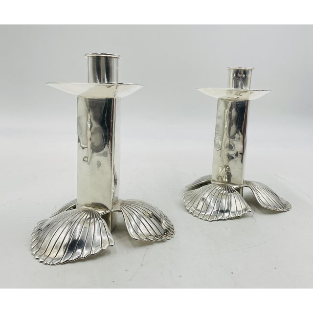 An elegant pair of silver-plated sculptural candlesticks designed by the renowned Mexican silversmith Emilia Castillo for...