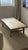 Substantial solid poplar coffee table with a low, architectural profile and traditional stretcher construction. The...