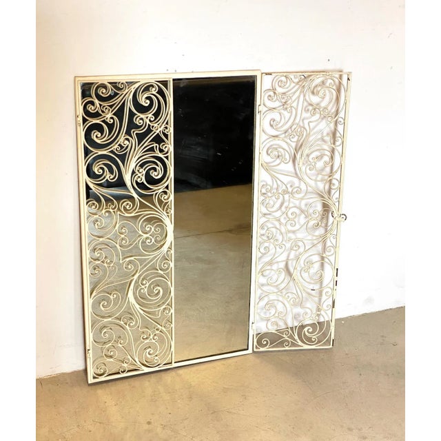 Mirror 50 years with lacquered iron doors and perforated