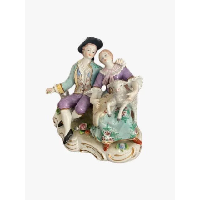 Late 19th Century English Victorian antique porcelain Continental Group having two figures sitting on a shaped base with...