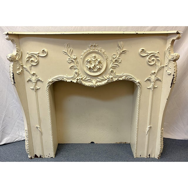 Wonderful antique architectural salvage mantel/ fireplace surround from the early 20th century. It is made of wood with...
