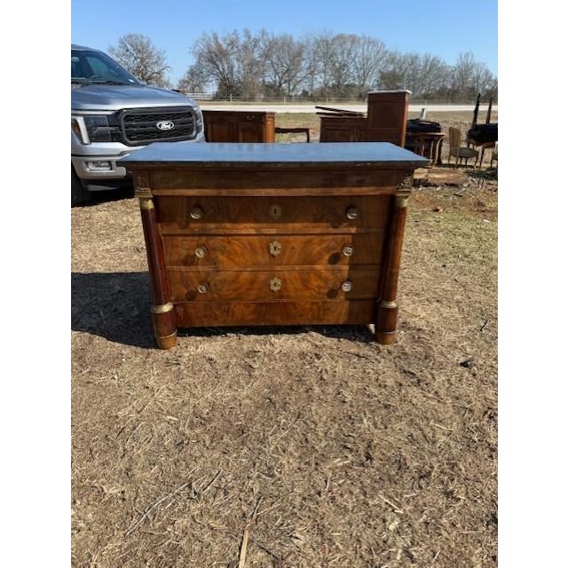 18th Century French Empire Commode from France. Made of Mahogany, with a black marble top, the wood has been finished with...
