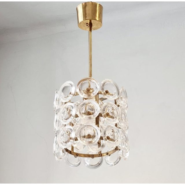 Rare pendant with brass base and glass by Orrefors. Designed by Carl Fagerlund for Fagerhult, Sweden mid-1900s. Measures:...