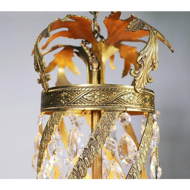 A fine louis xv or rococo style belle époque chandelier. It is richly sculpted in brass or bronze with rocaille foliage,...