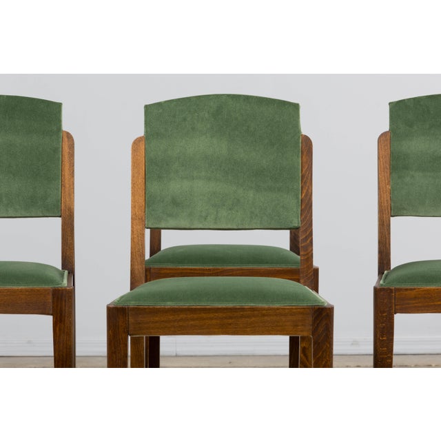 A beautifully restored set of six late 1930s French Art Deco dining chairs, sourced in France. Crafted in oak, each chair...