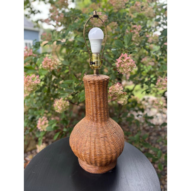 Vintage table lamp by Prestige featuring a beautifully sculpted basket-weave body in a warm honey-brown finish. The tall...
