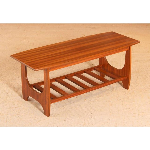 Mid Century mahogany coffee table with a magazine rack, circa 1960s. Excellent restored condition. W 100cm D 40cm H 40cm