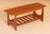 Mid Century mahogany coffee table with a magazine rack, circa 1960s. Excellent restored condition. W 100cm D 40cm H 40cm