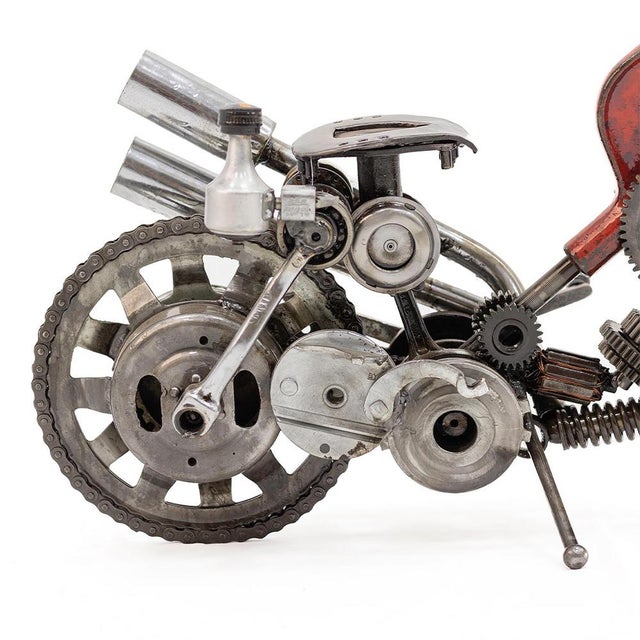 One-of-a-kind contemporary motorcycle sculpture handcrafted from recycled mechanical parts, featuring a highly detailed...