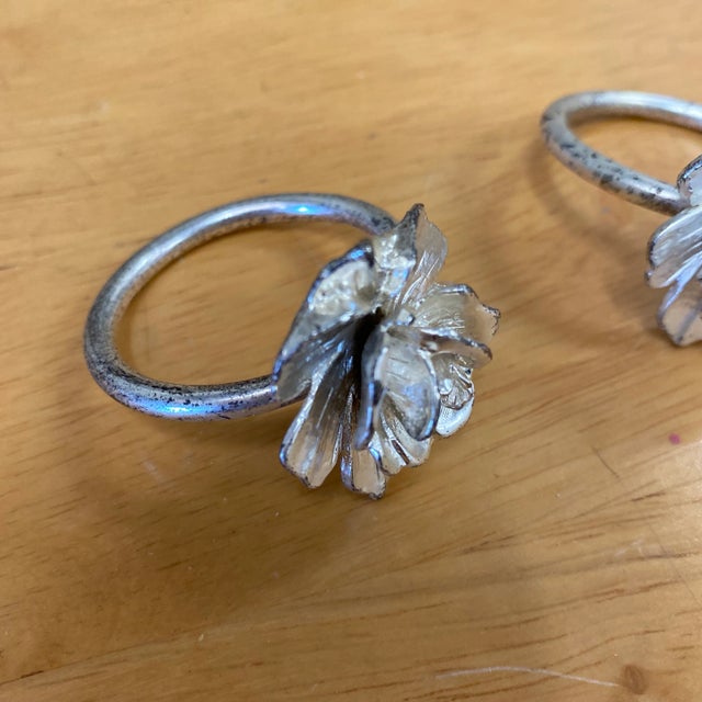 Beautiful set of 3 silver floral napkin ring holders. Perfect to add character to any tablescape and for the interior...