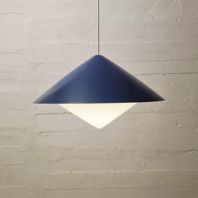 Ceiling light designed by Svea Winkler. Produced in Finland by Orno. Blue lacquered metal shade and acrylic diffuser. Good...