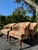 Charming set of four vintage game table chairs featuring a classic warm-toned plaid upholstery in shades of burgundy, tan,...
