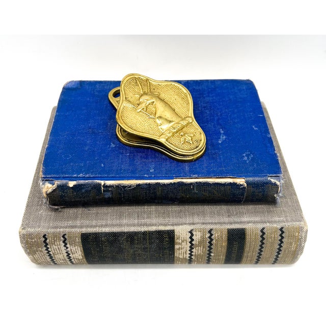 Charming vintage brass wall-mounted clip featuring a sculptural stag head with antlers. Made by Randolph and dated July...