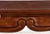 Dating to the late 20th century, this vintage console table is crafted from mahogany and features a rectangular top with...
