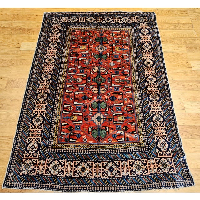 A rare gem from the early 1900s, this antique Caucasian Shirvan area rug stands out not only for its extraordinary...