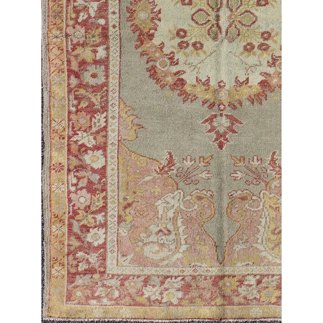 Turkish Oushak vintage rug with floral medallion design in red and light blue, Keivan Woven Arts / rug en-461, country of...