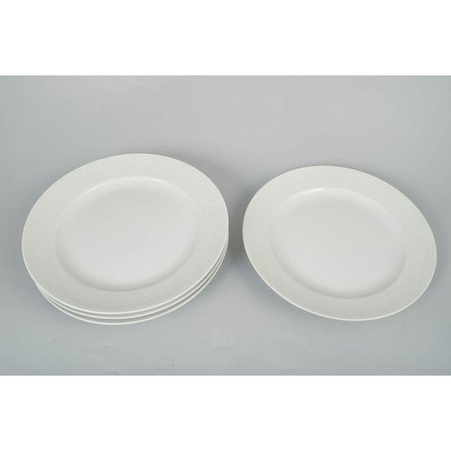 Axel Salto for Royal Copenhagen, set of four dinner plates. Elegant set of four porcelain dinner plates with refined...