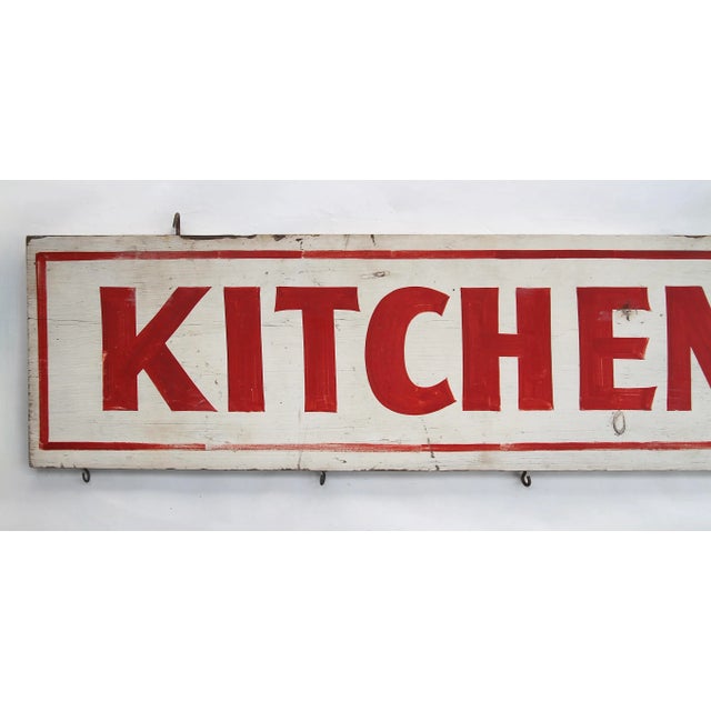 Circa 1940s red and white wood hand lettered two sided Kitchenettes motel sign. Sign has original hooks for hanging. Sign...