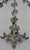 This is a stunning silver plate epergne with four removable arms and an engraved glass bowl. Three ornate feet lead up to...