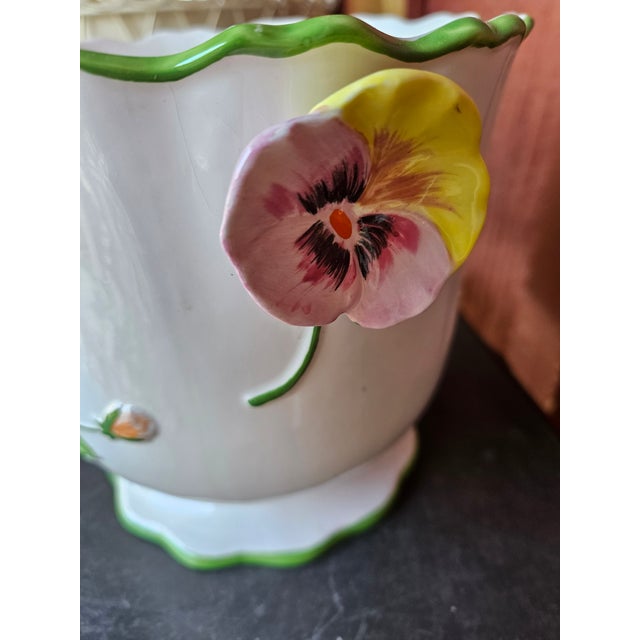 Very pretty white cachepot with scalloped top with a green pinstripe. Floral design and Pansey Handles. Very charming, a...