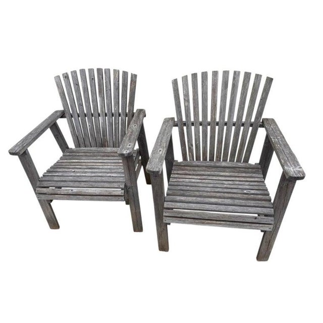 Pair of rustic teak Adirondack lawn or beach chairs in good condition.These chairs have a marine boat varnish protective...