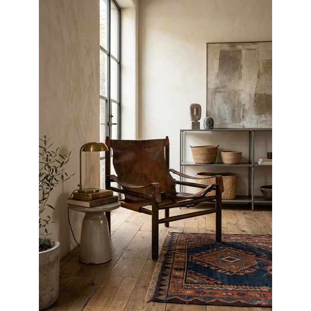 Original and unique vintage Safari armhair in the manner of Swedish furniture designer, Arne Norell, from the same period,...