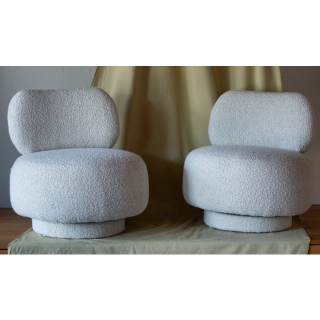 These lovely round accent chairs have vintage swivel frames that smoothly glide from side to side. Recently reupholstered...